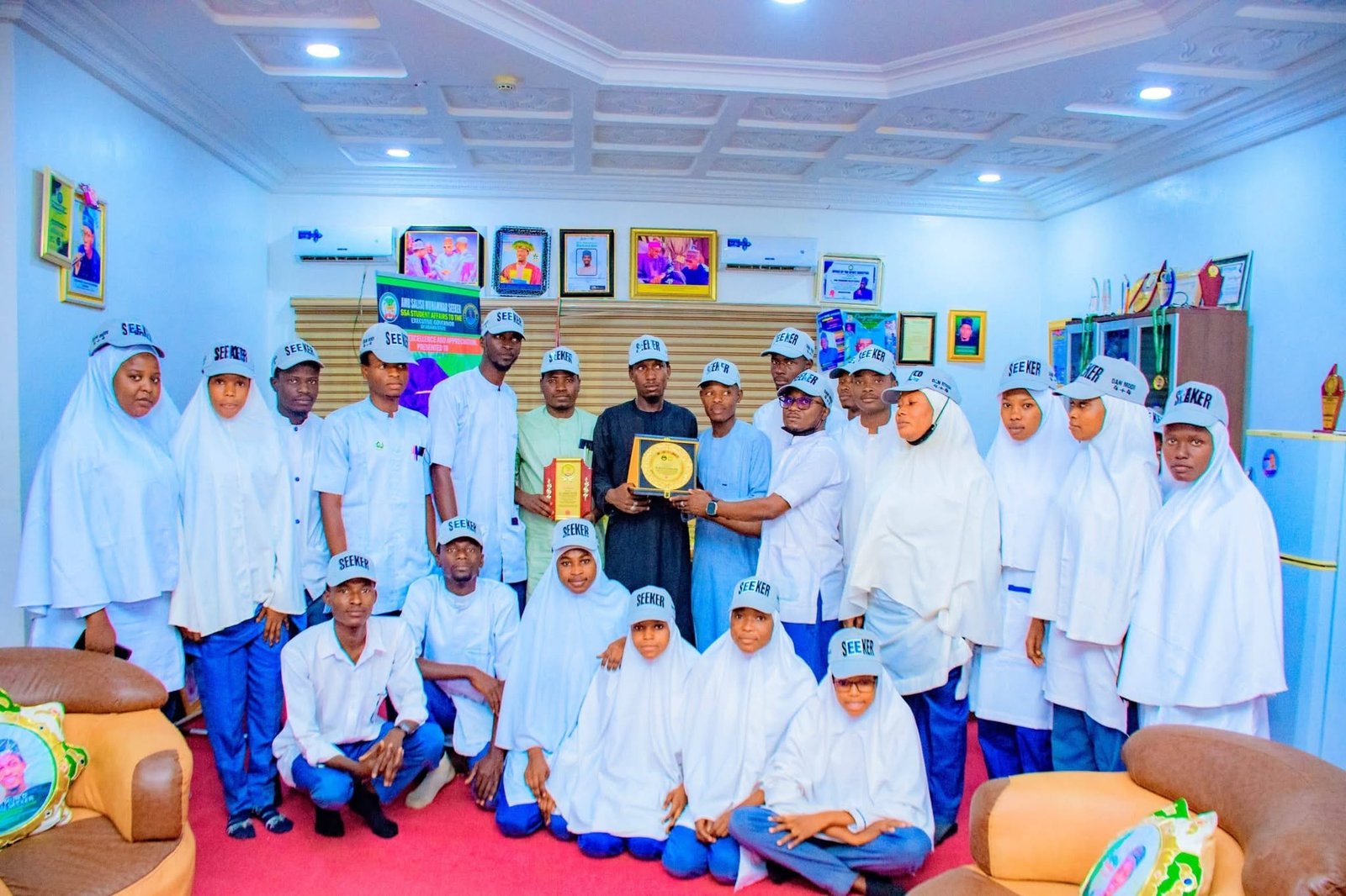 Students receiving an award at the SSA office